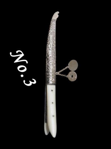 Traditional Cretan knife with bone handle and carved silver case Traditional Cretan knife with bone handle and carved silver case