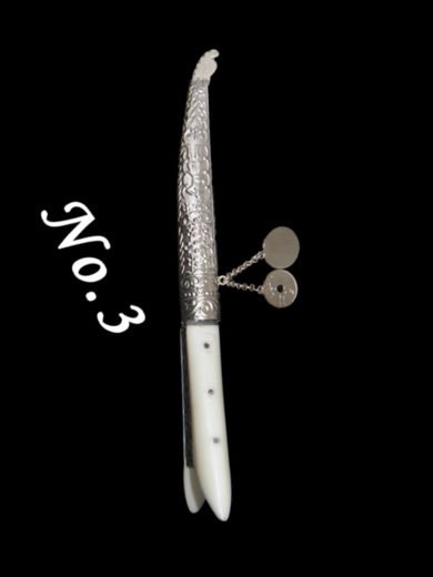 Traditional Cretan knife with plastic handle and carved silver case Traditional Cretan knife with plastic handle and carved silver case